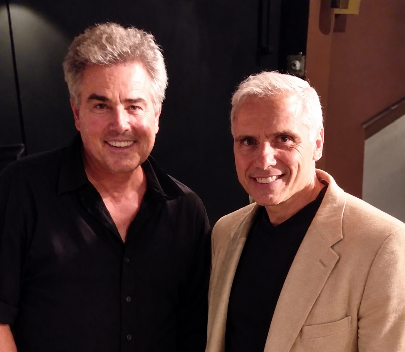 Herbie J Pilato with a man in a black shirt