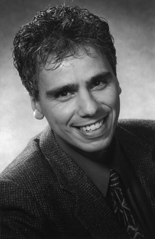 Young Herbie J Pilato smiling in a black-and-white portrait
