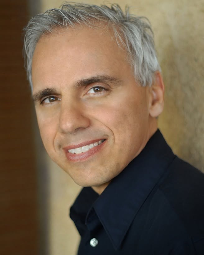 Herbie J Pilato smiling in a close-up portrait