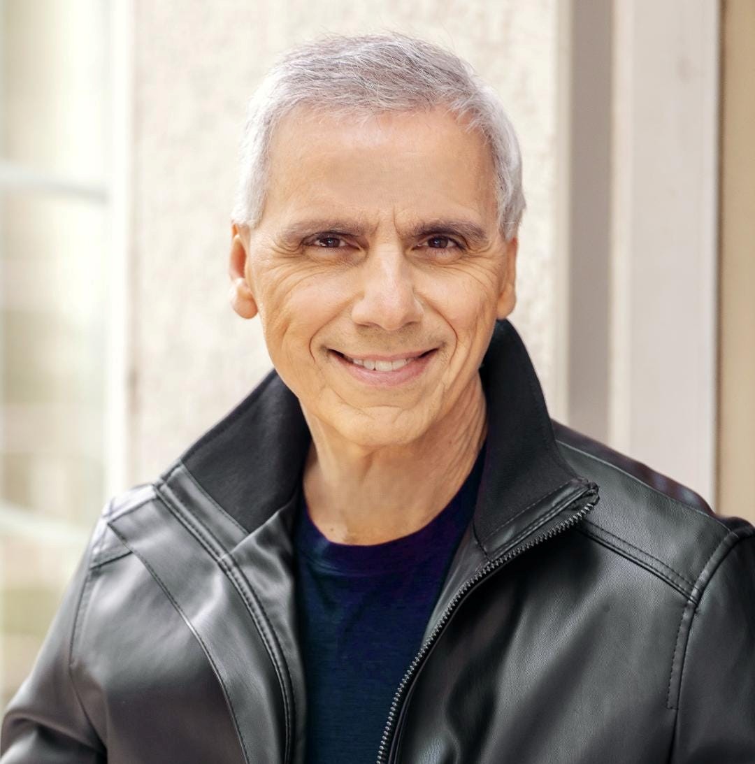 Herbie J Pilato wearing a black leather jacket