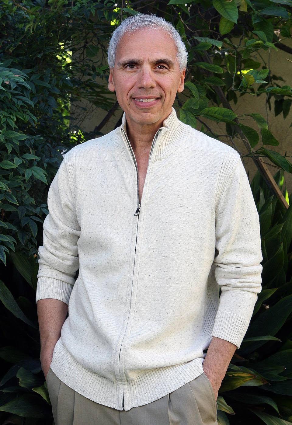 Herbie J Pilato wearing a cream-colored sweater outdoors
