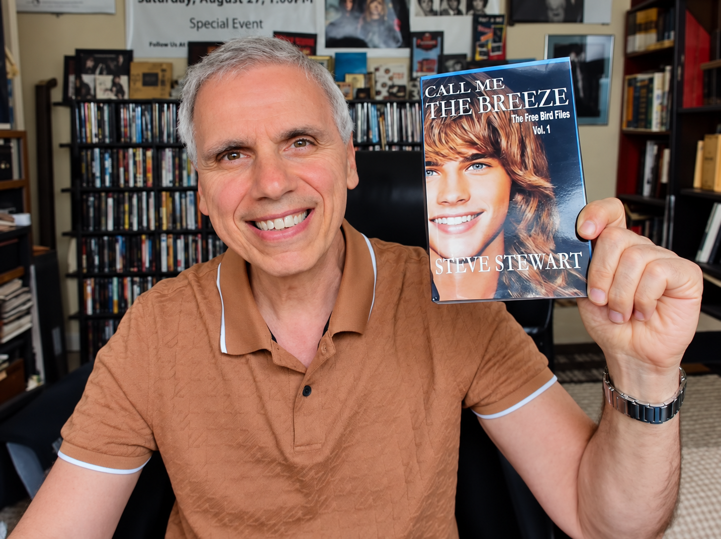 Herbie J holding Volume 1 of Steve Stewart’s The Freebird Files