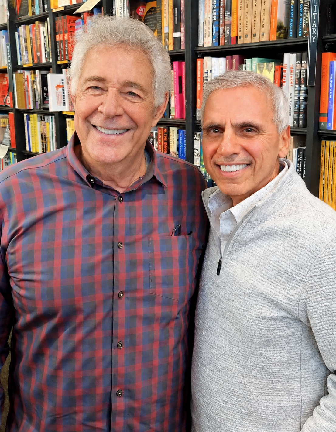 Herbie J Pilato with Barry Williams in front of bookshelves
